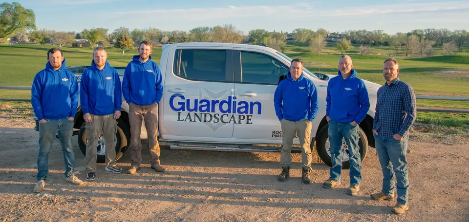 Guardian Landscape crew in front of a company truck in the Prescott area